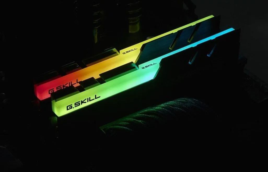 G.Skill RAM sticks glowing in the dark with visible branding.